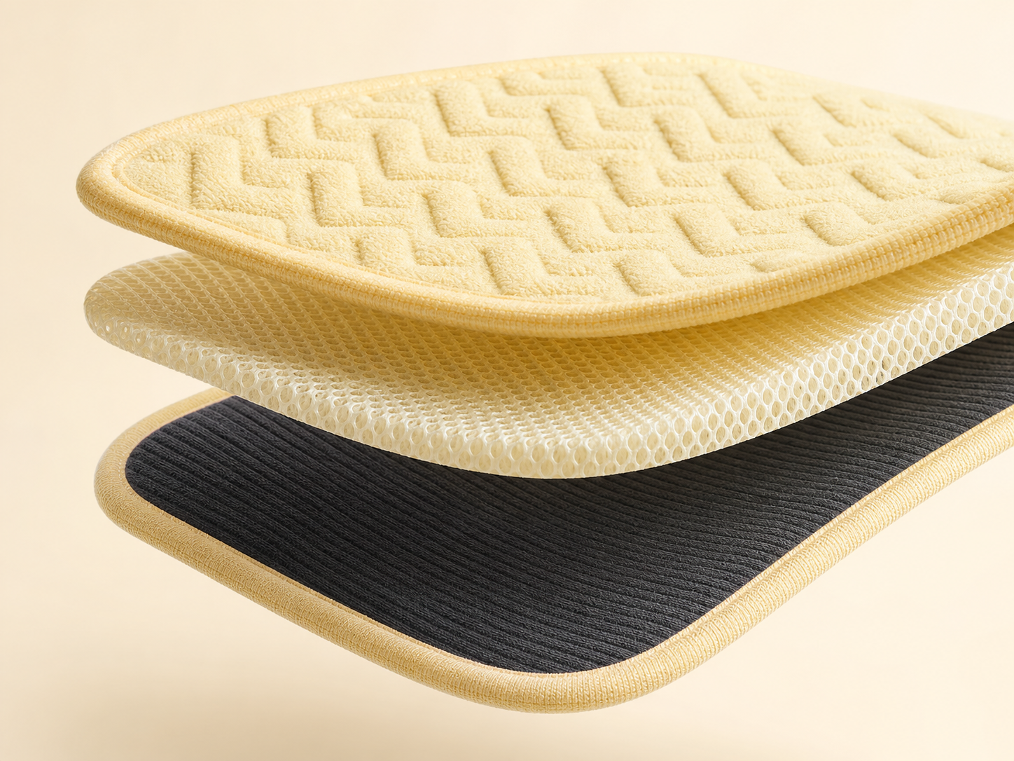 Exploded view of MotionPad with microfiber, 3mm MotionCore spacer mesh, and corduroy layers